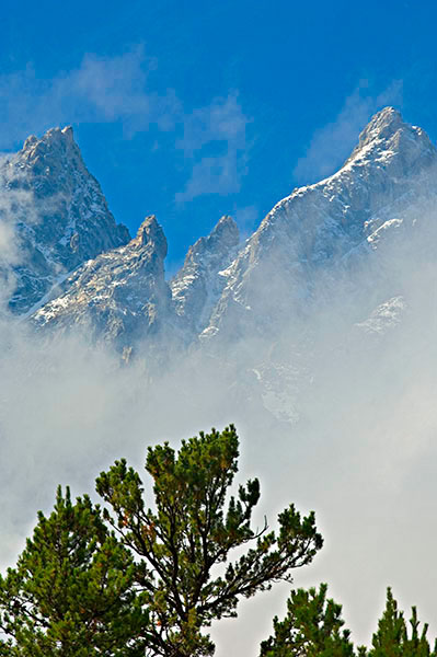 The Cathedral Group of the Grand Tetons through the morning mist located in Grand Teton National Park, Northwest Wyoming
